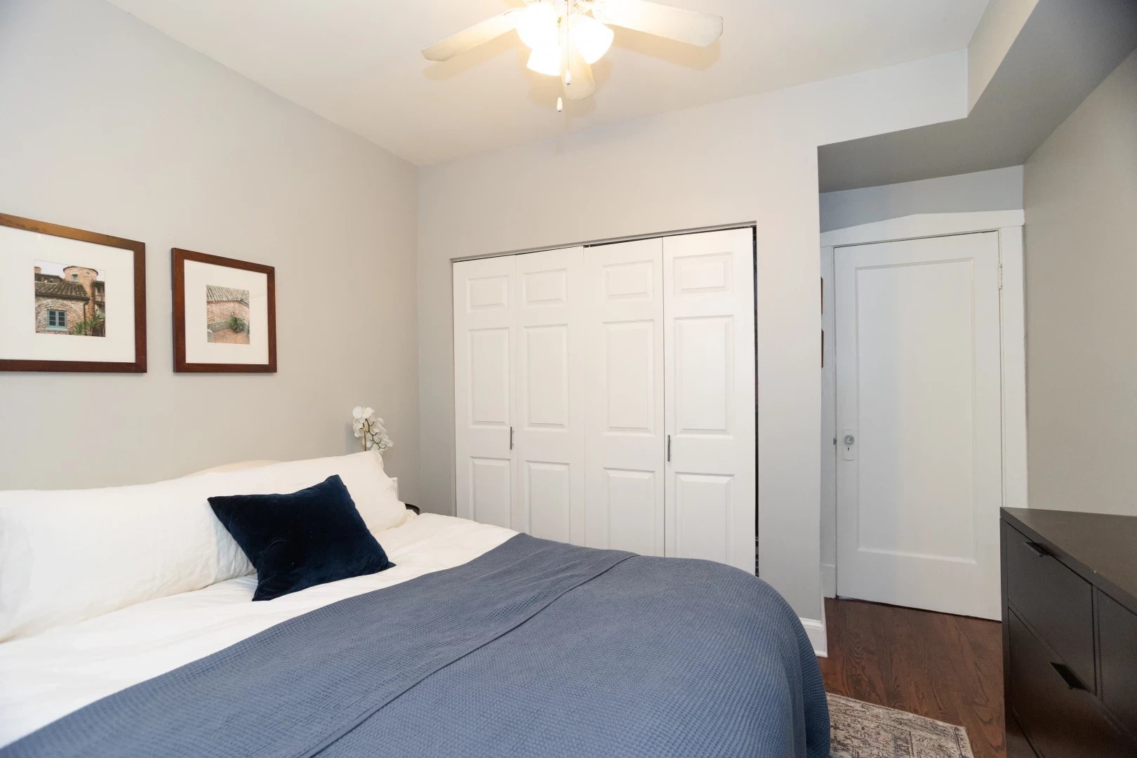 2026 North Burling Street, Unit 208 Chicago, IL 60614 - Photo 10 of 14 a bedroom with a bed and a chandelier