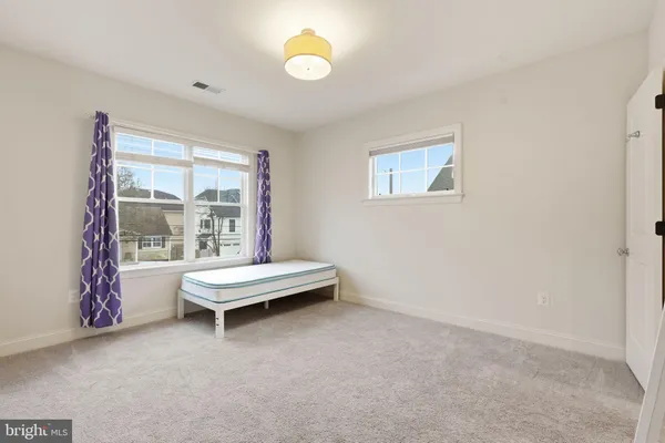 a living room with furniture and window