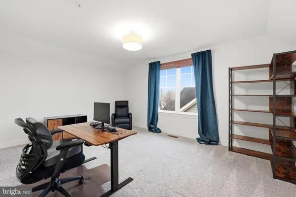 a workspace with furniture and window