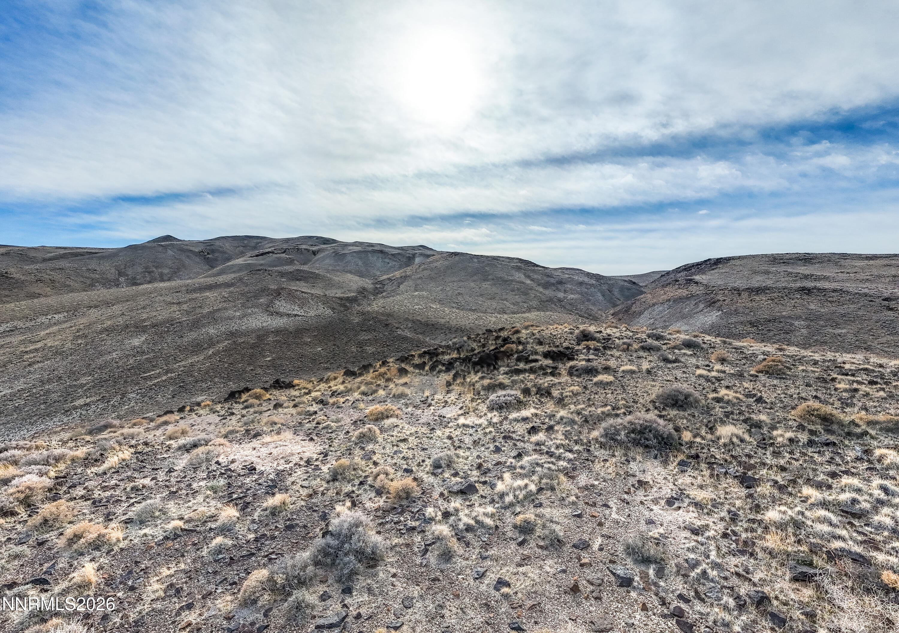 16642 Power Line Road Fallon, NV 89406 - Photo 36 of 54 a view of a large mountain with mountains in the background
