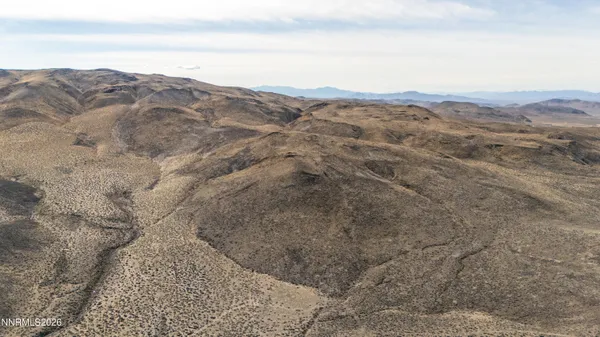 a view of an ocean beach and mountain