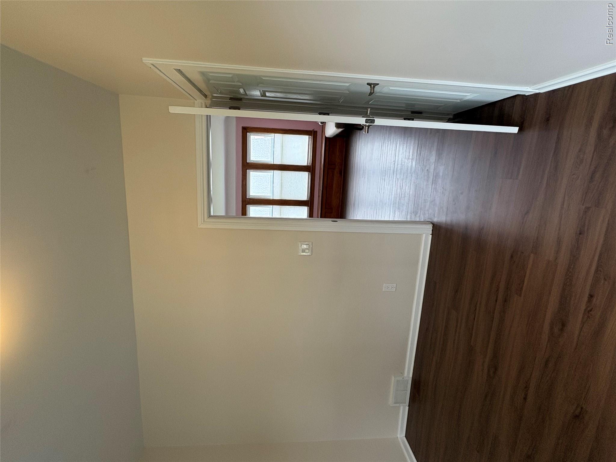 2175 West Auburn Road Rochester, MI 48309 - Photo 22 of 30 Spare room with baseboards and dark wood-style flooring