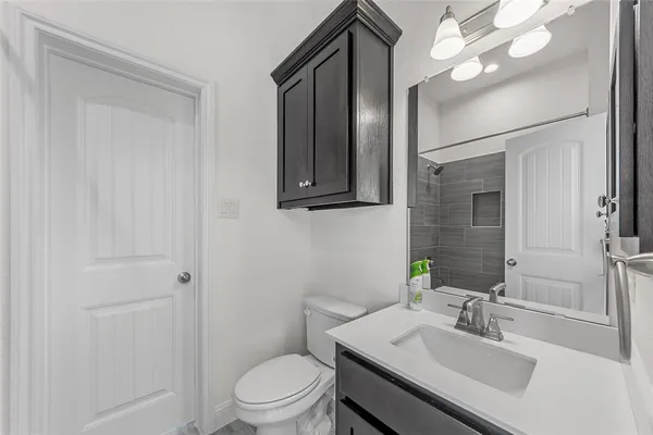 a kitchen with stainless steel appliances granite countertop a stove and a refrigerator