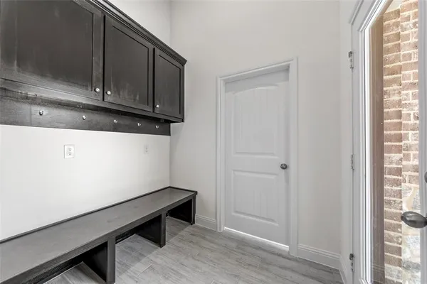 a kitchen with stainless steel appliances a stove top oven and cabinets