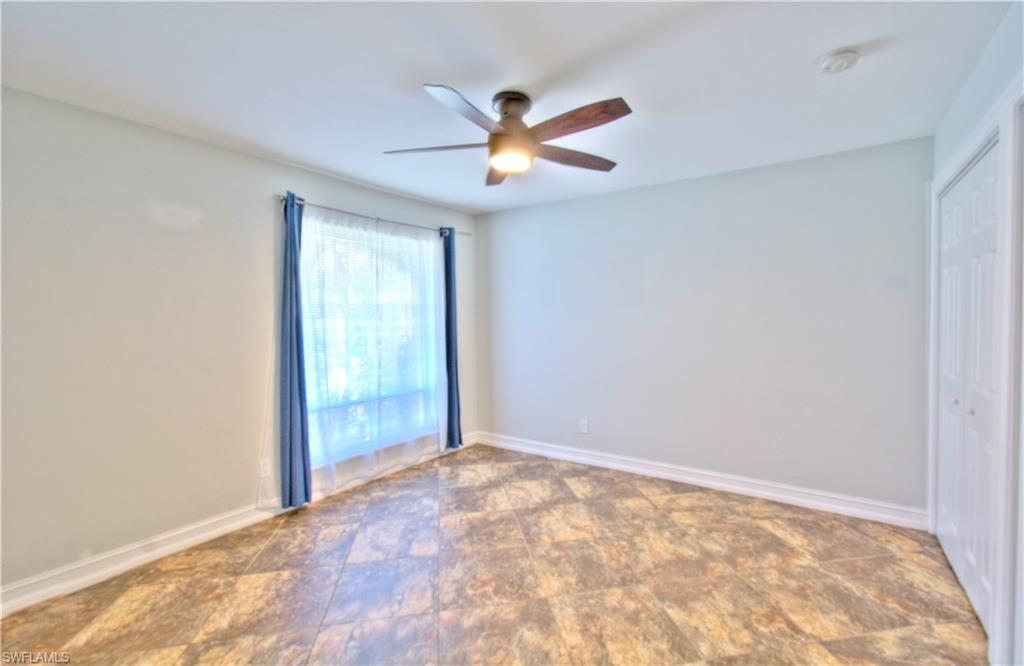787 Palm View Drive, Unit 3 Naples, FL 34110 - Photo 18 of 27 a view of an empty room with a window
