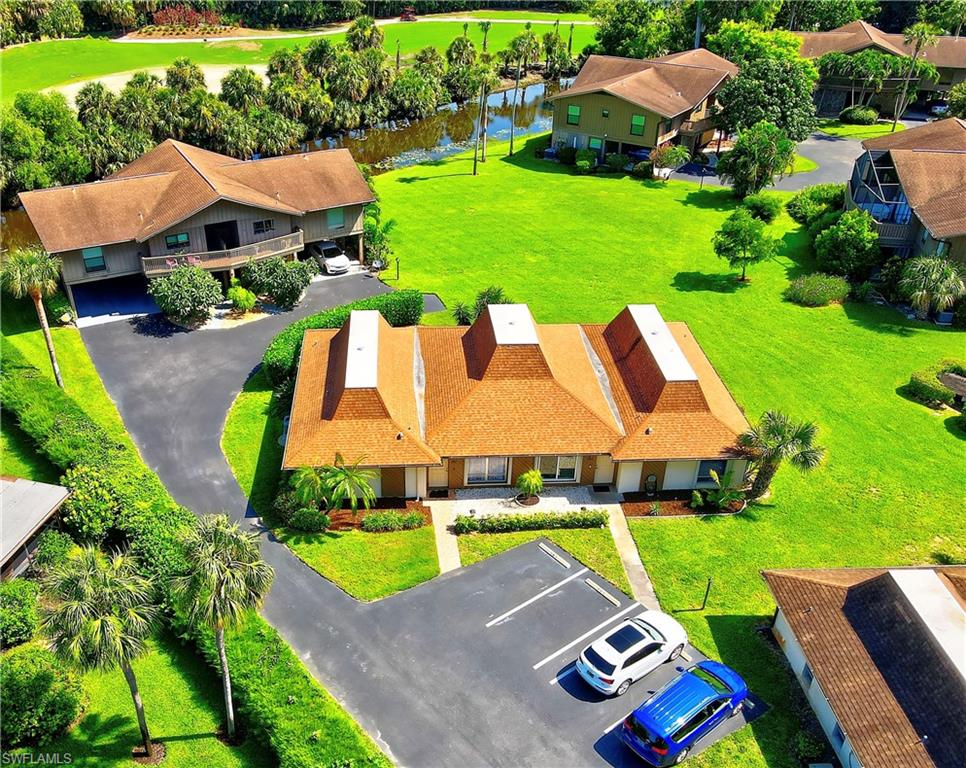 787 Palm View Drive, Unit 3 Naples, FL 34110 - Photo 26 of 27 an aerial view of a house with garden space and street view
