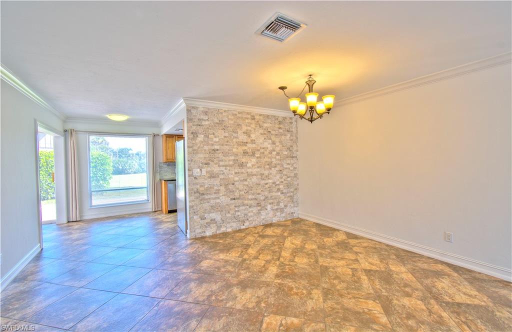 787 Palm View Drive, Unit 3 Naples, FL 34110 - Photo 7 of 27 a view of an empty room with a window