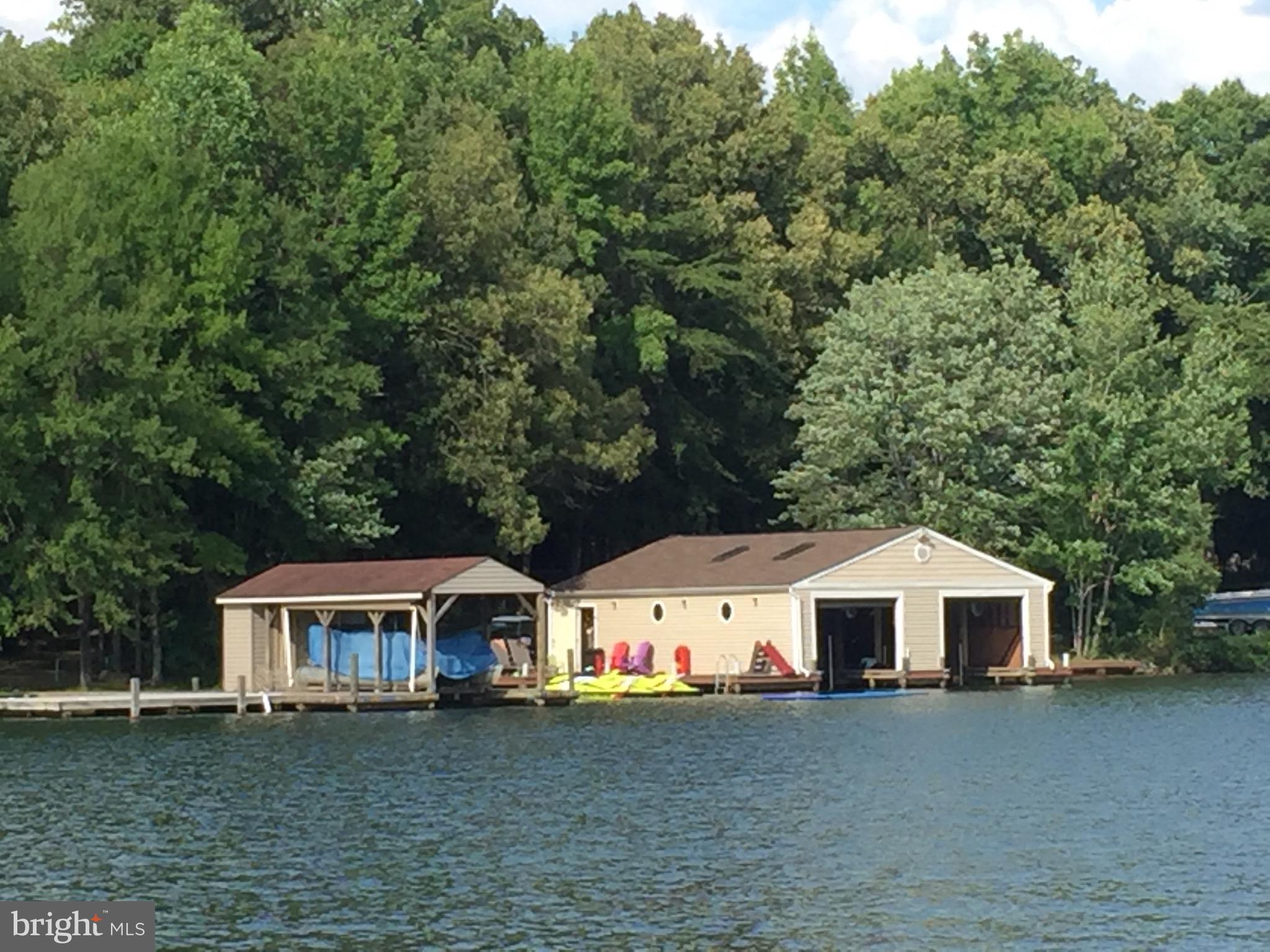Enclosed boathouse with 2 lifts.