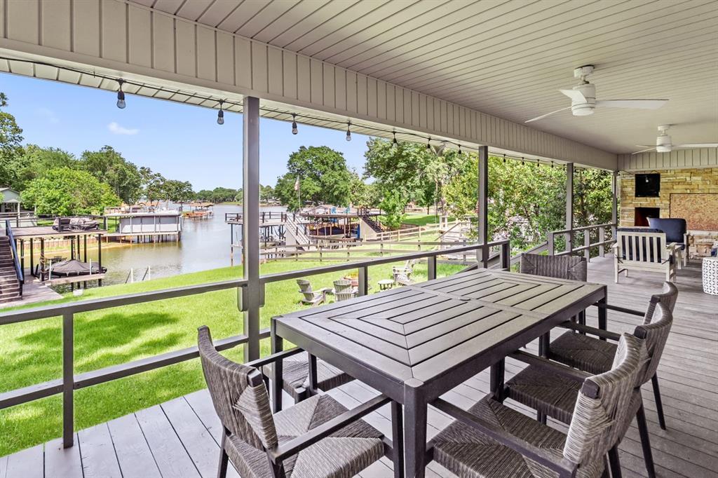 111 Ridgeoak Way Tool, TX 75143 - Photo 15 of 24 a patio with wooden floor a yard tables and chairs