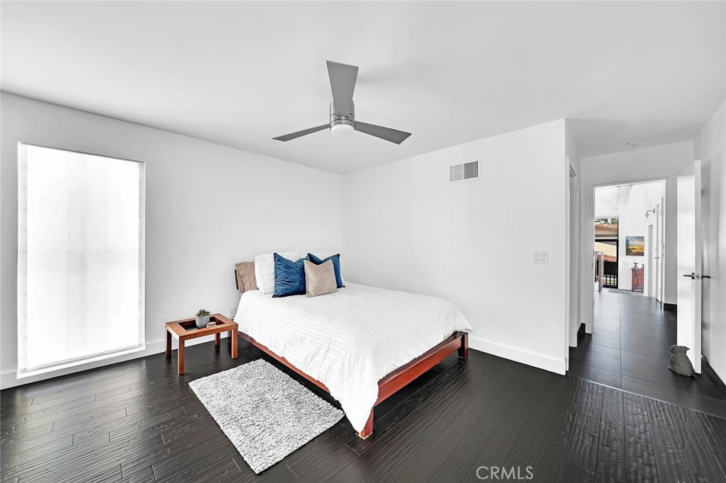 6301 Marina Pacifica Drive Long Beach, CA 90803 - Photo 11 of 39 a bed sitting in a spacious bedroom next to a window