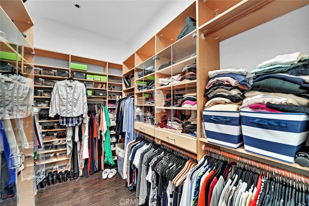 6301 Marina Pacifica Drive Long Beach, CA 90803 - Photo 20 of 39 a view of walk in closet with clothes and shoes