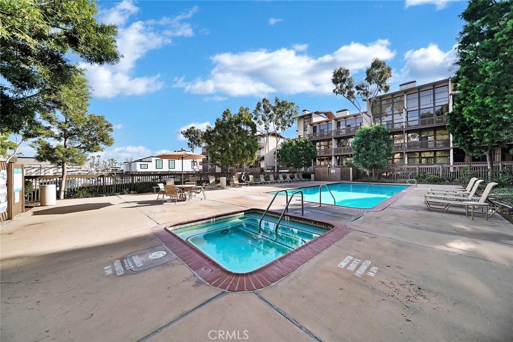 6301 Marina Pacifica Drive Long Beach, CA 90803 - Photo 29 of 39 a view of a swimming pool with a patio