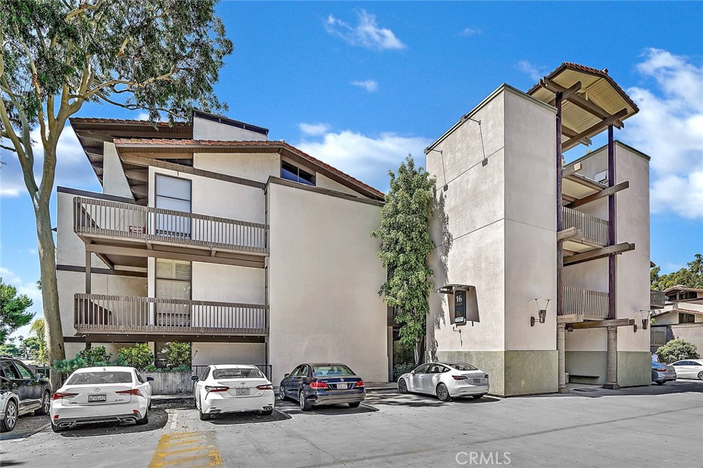 6301 Marina Pacifica Drive Long Beach, CA 90803 - Photo 33 of 39 a car parked in front of a building