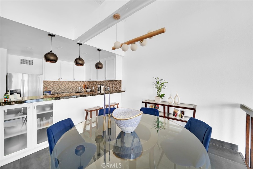 6301 Marina Pacifica Drive Long Beach, CA 90803 - Photo 9 of 39 a living room with furniture and kitchen view