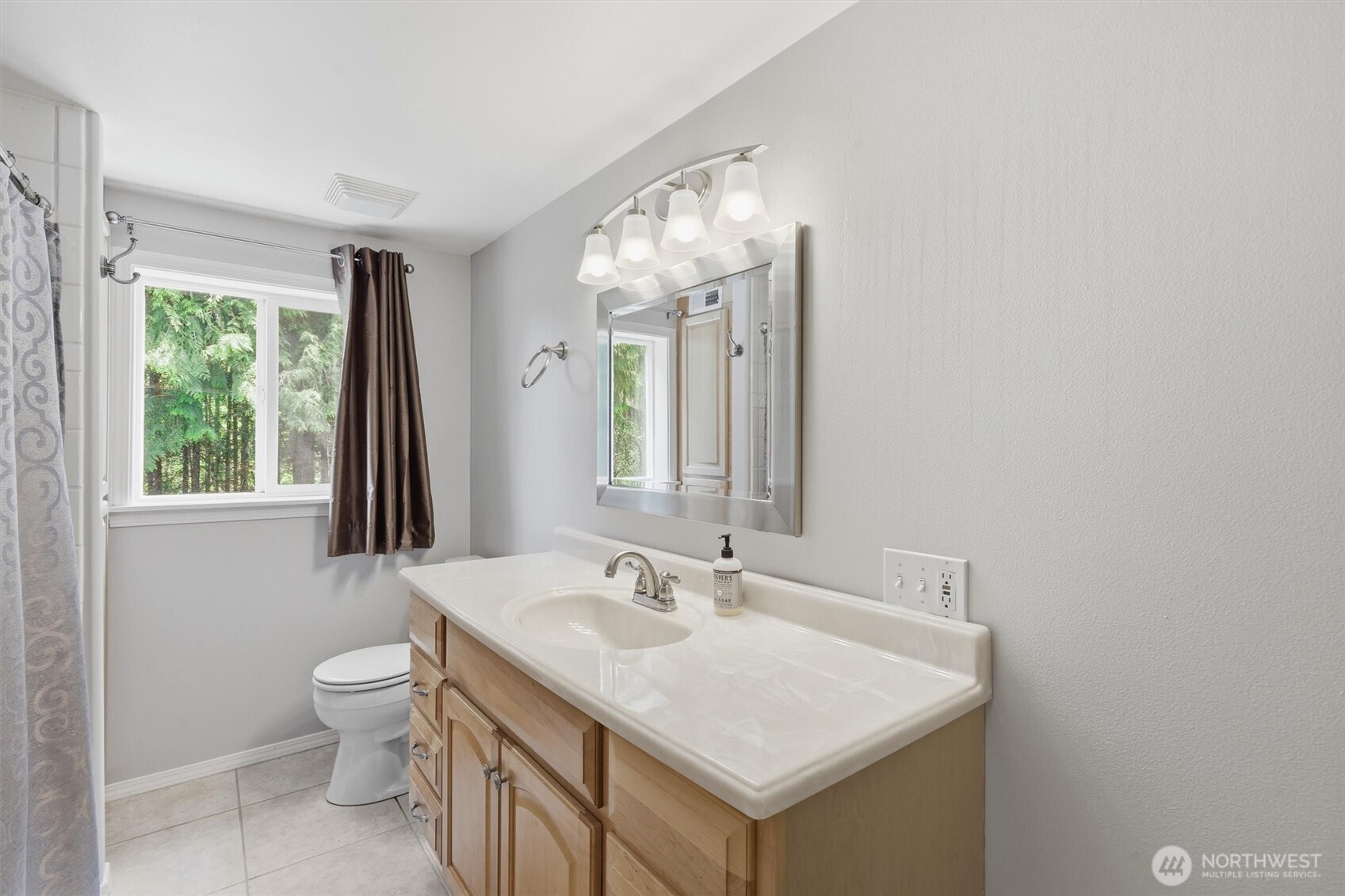 5523 East Wishon Road Snohomish, WA 98290 - Photo 30 of 39 a bathroom with a sink a toilet and a mirror