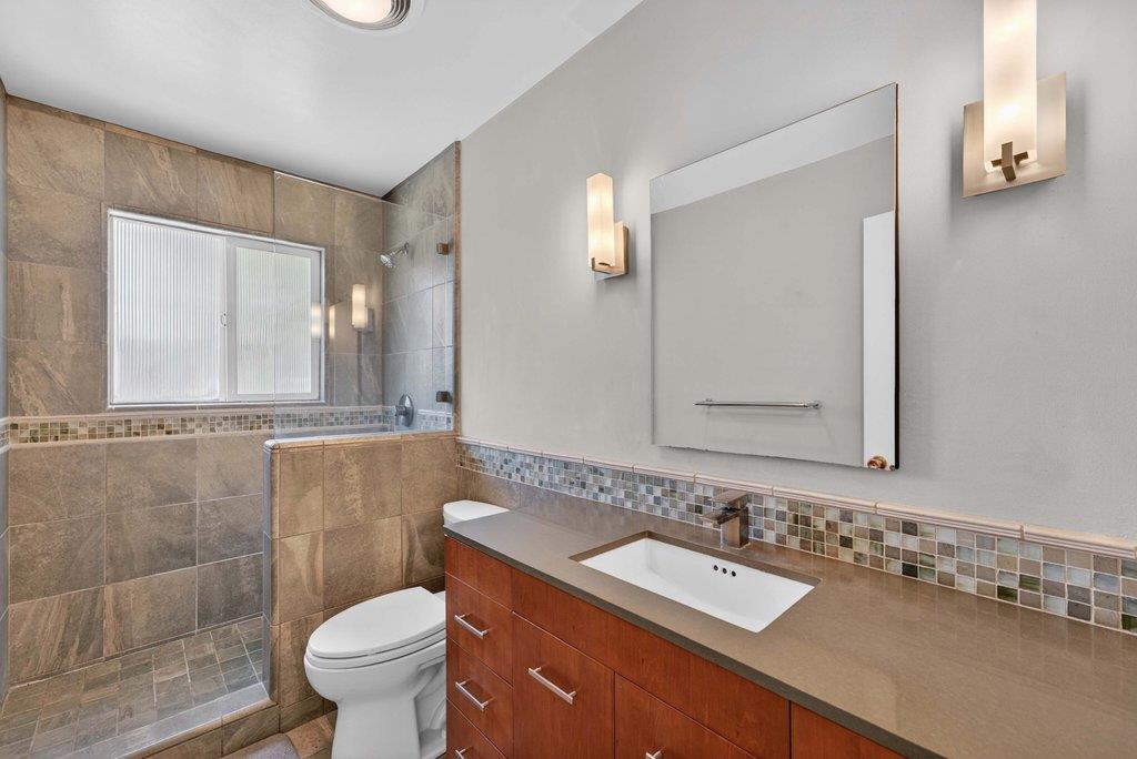 505 Hidden Valley Road Watsonville, CA 95076 - Photo 23 of 72 a bathroom with a sink and a mirror