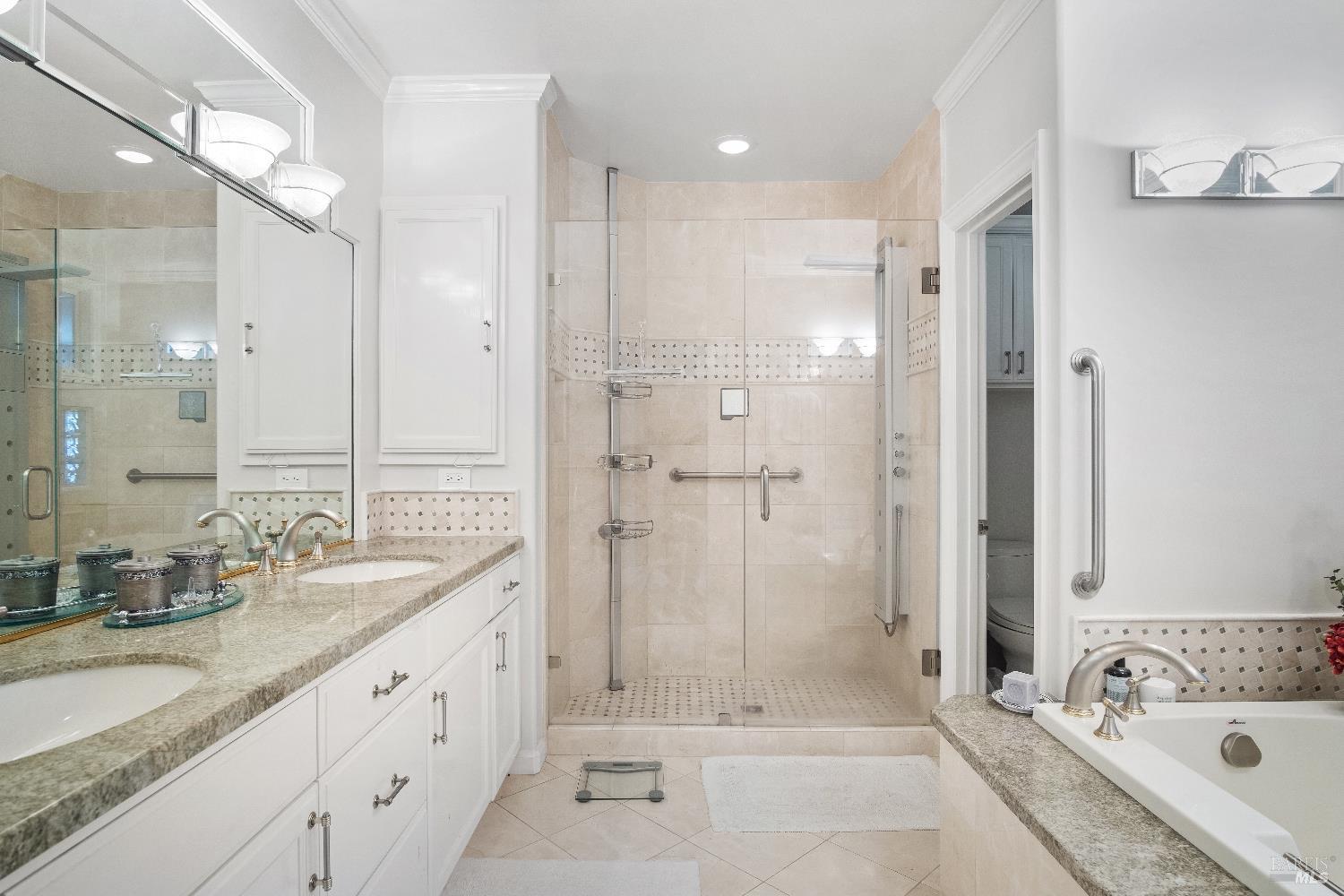 6 Oak Road Larkspur, CA 94939 - Photo 18 of 41 a bathroom with a granite countertop tub sink shower and mirror