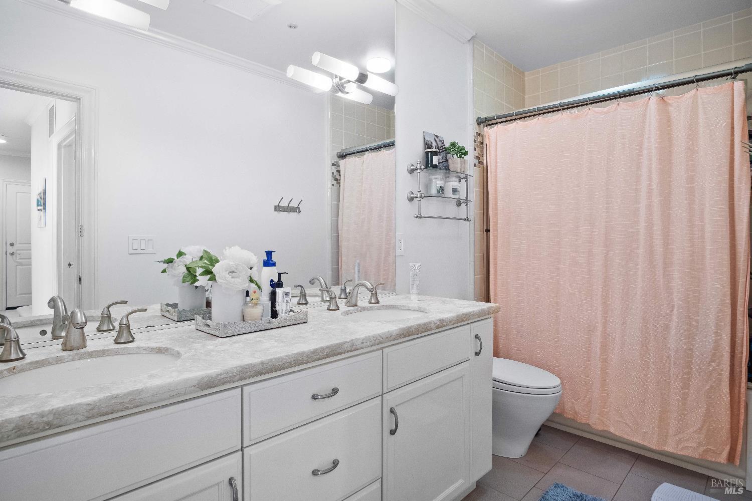 6 Oak Road Larkspur, CA 94939 - Photo 25 of 41 a bathroom with a granite countertop sink a toilet and a mirror
