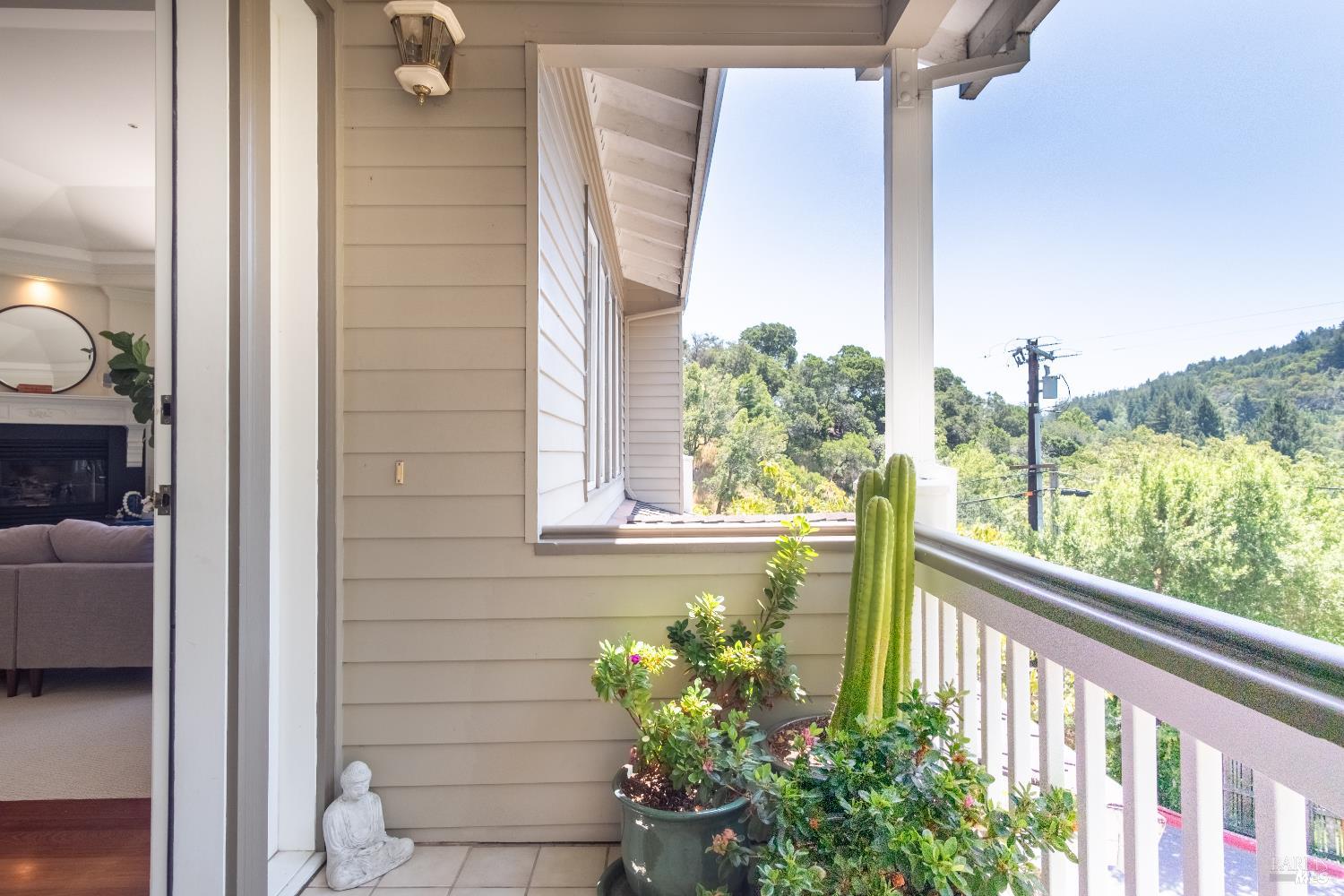 6 Oak Road Larkspur, CA 94939 - Photo 37 of 41 a view of a balcony with couches potted plants with wooden floor