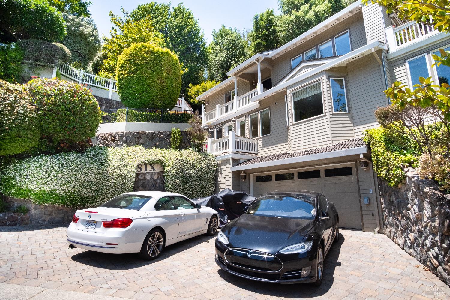 6 Oak Road Larkspur, CA 94939 - Photo 39 of 41 a car parked in front of a white house
