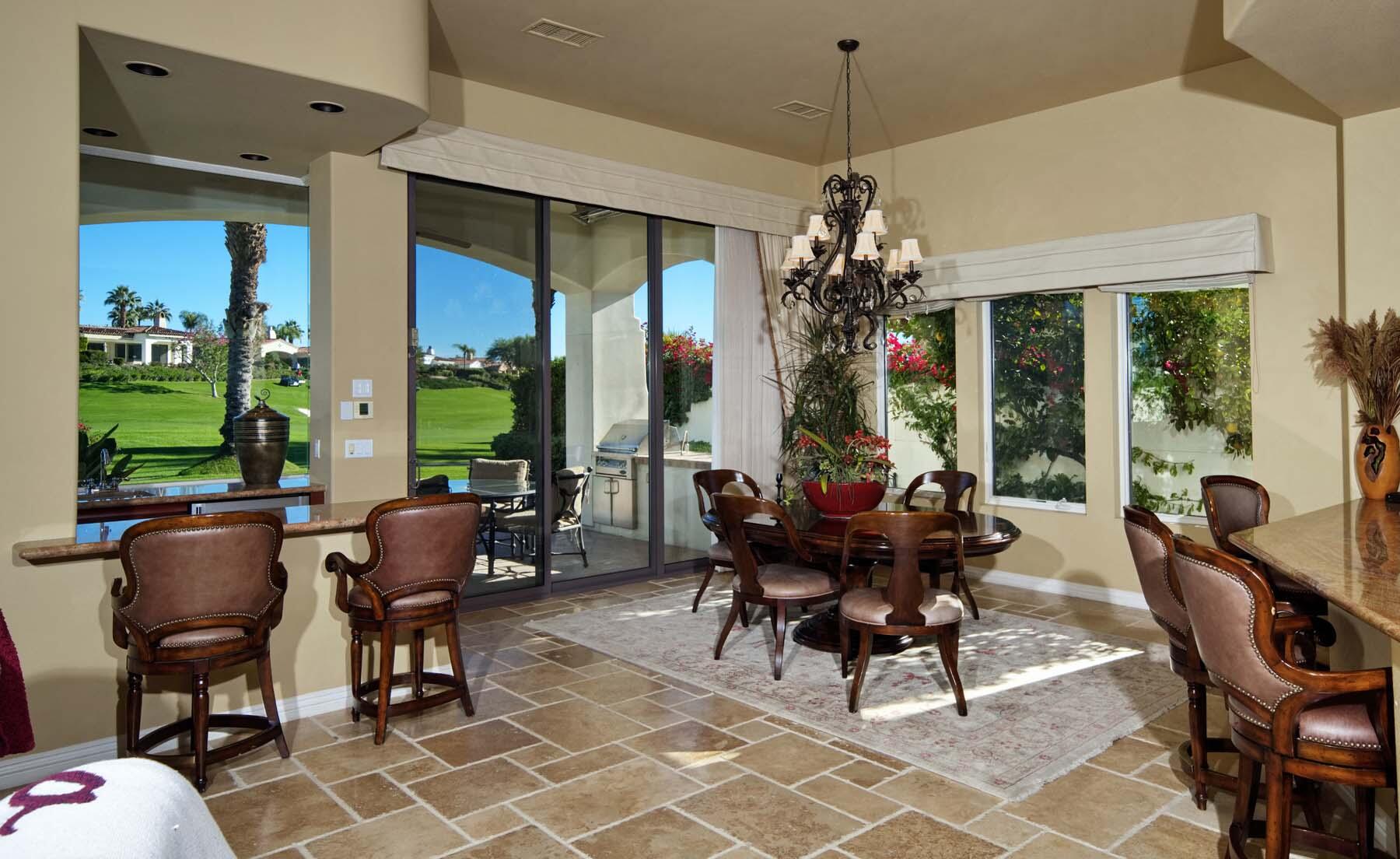 76128 Via Firenze Indian Wells, CA 92210 - Photo 13 of 67 a living room filled with furniture and a chandelier