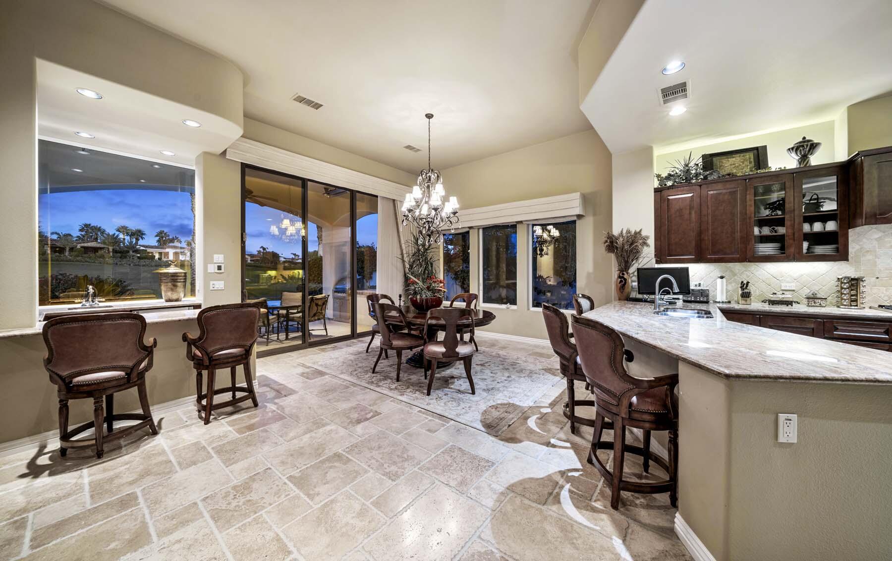 76128 Via Firenze Indian Wells, CA 92210 - Photo 14 of 67 a view of a dining area with furniture