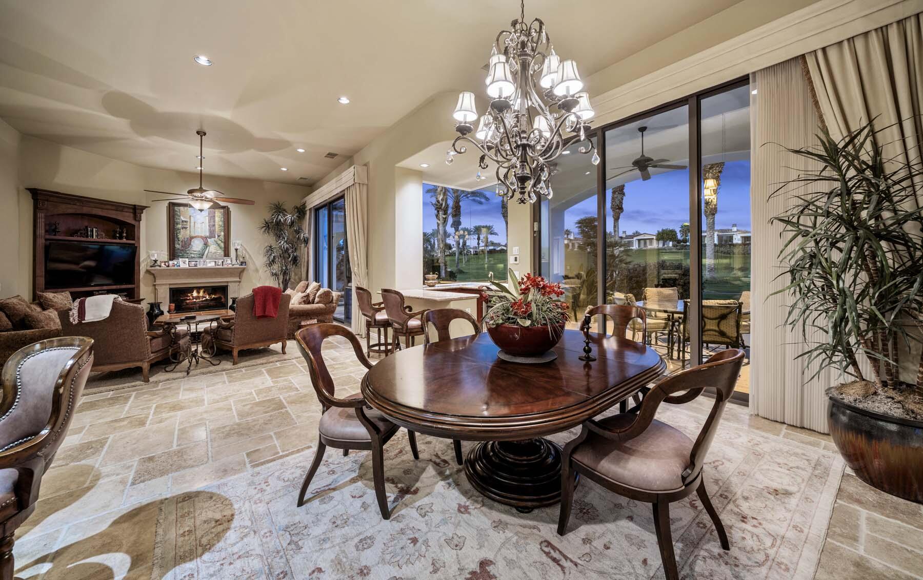 76128 Via Firenze Indian Wells, CA 92210 - Photo 16 of 67 a view of a dining room with furniture a chandelier and window