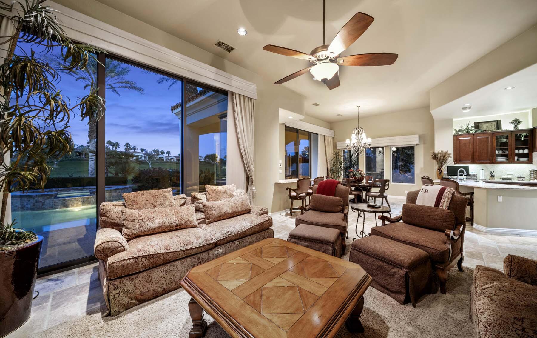 76128 Via Firenze Indian Wells, CA 92210 - Photo 18 of 67 a living room with furniture ceiling fan and a large window
