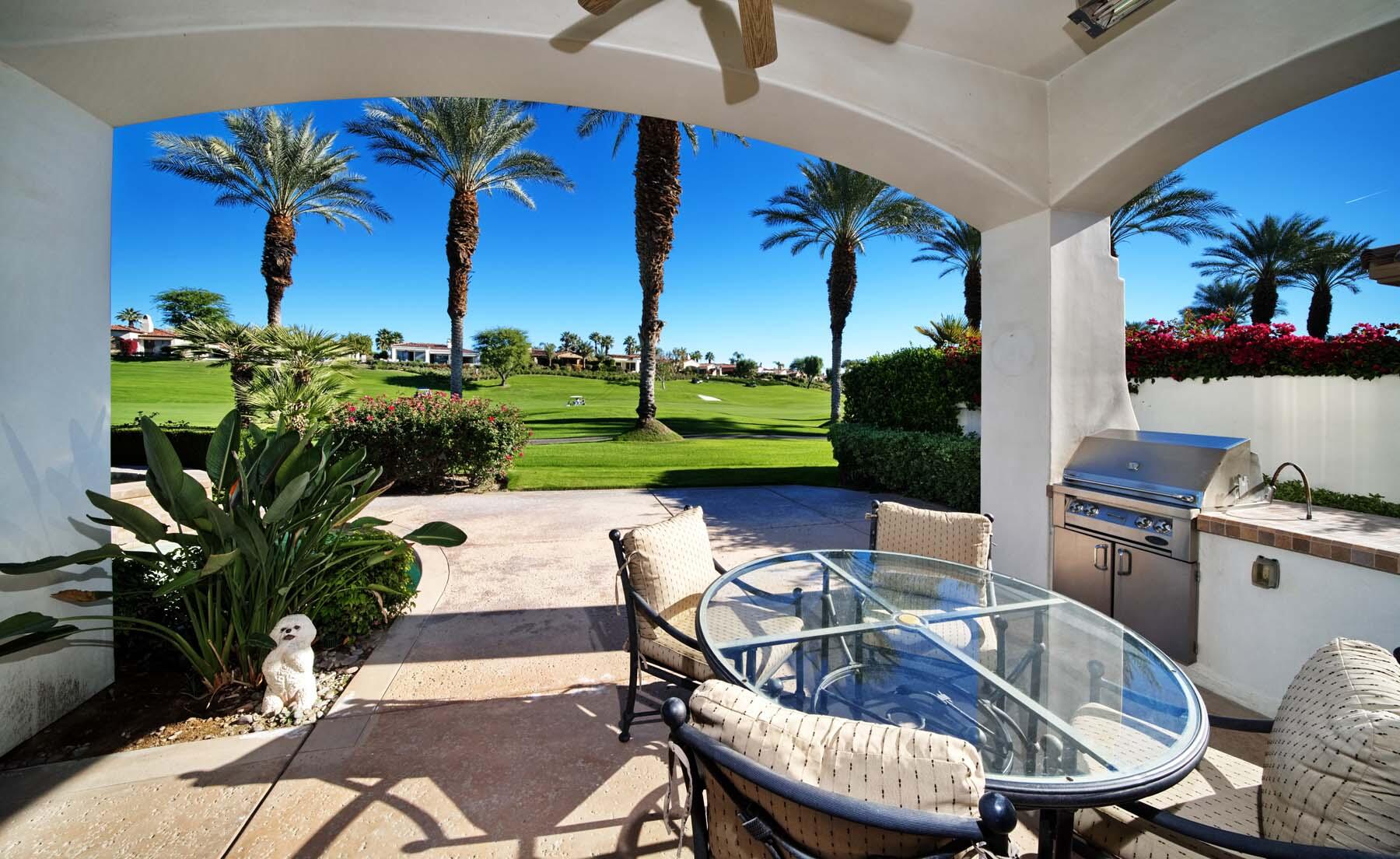 76128 Via Firenze Indian Wells, CA 92210 - Photo 21 of 67 a view of a patio with furniture and a yard