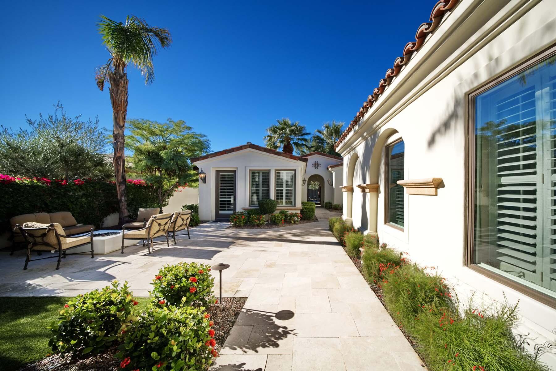 76128 Via Firenze Indian Wells, CA 92210 - Photo 3 of 67 a view of a patio with table and chairs and potted plants