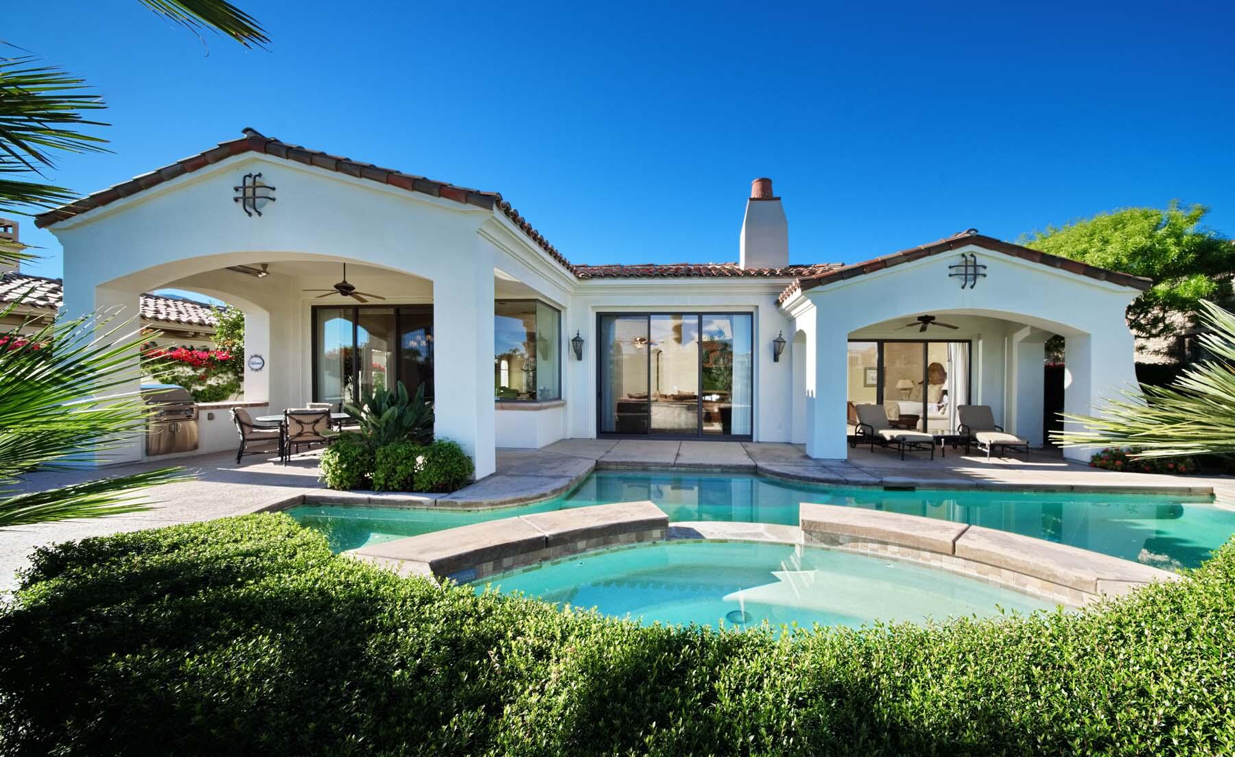 76128 Via Firenze Indian Wells, CA 92210 - Photo 31 of 67 a front view of a house with swimming pool having outdoor seating