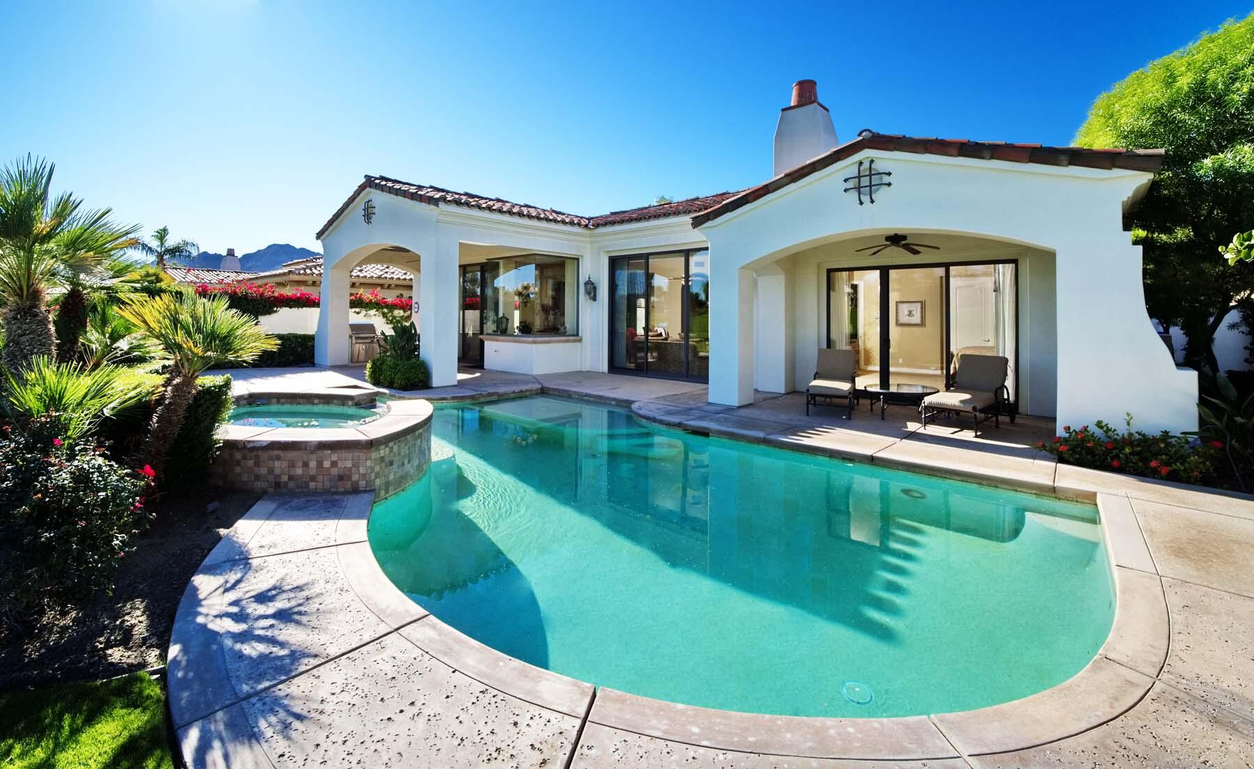 76128 Via Firenze Indian Wells, CA 92210 - Photo 33 of 67 a view of a house with a swimming pool