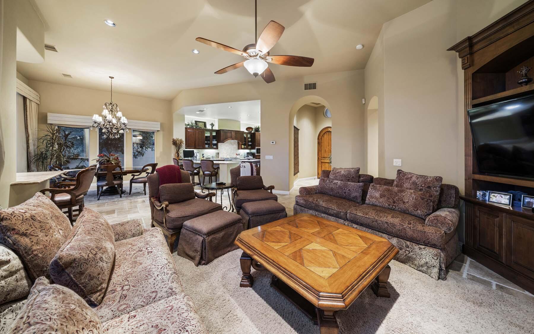 76128 Via Firenze Indian Wells, CA 92210 - Photo 35 of 67 a living room with furniture ceiling fan and a flat screen tv