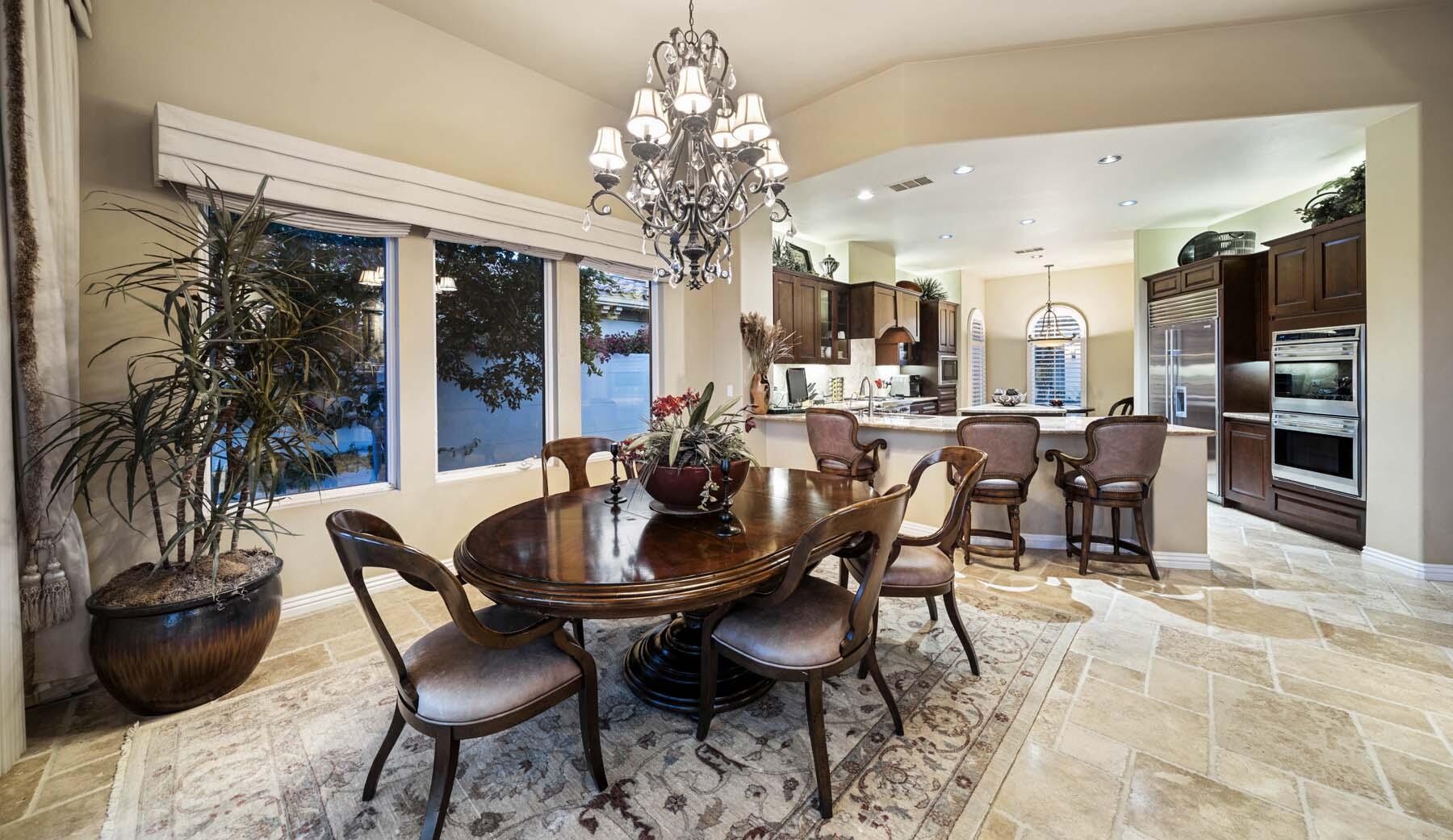 76128 Via Firenze Indian Wells, CA 92210 - Photo 37 of 67 a view of a dining room with furniture and chandelier