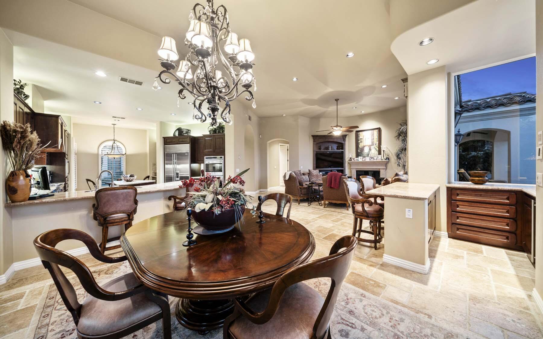 76128 Via Firenze Indian Wells, CA 92210 - Photo 38 of 67 a view of a dining room with furniture and a chandelier