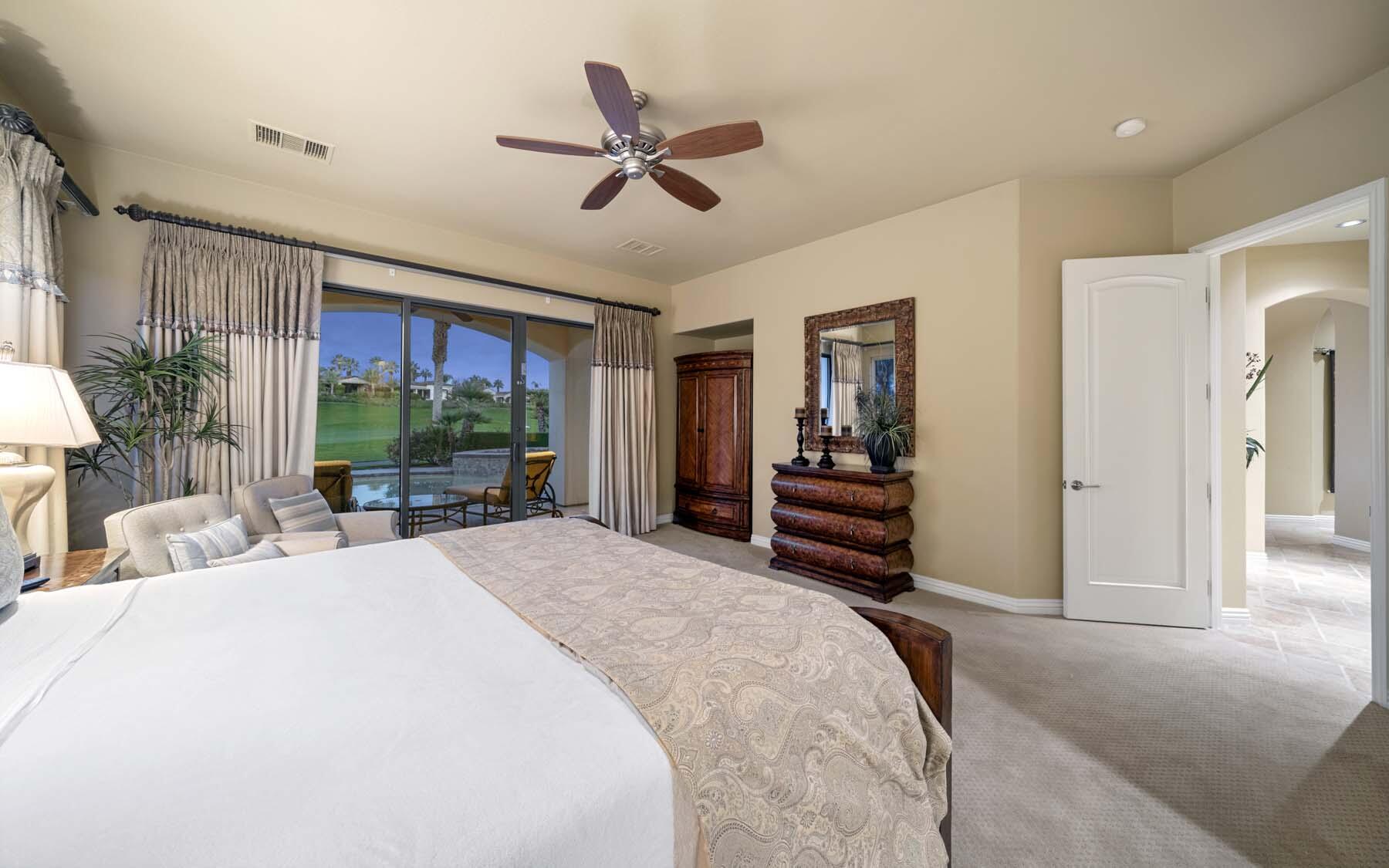 76128 Via Firenze Indian Wells, CA 92210 - Photo 46 of 67 a bed room with a bed and a large mirror