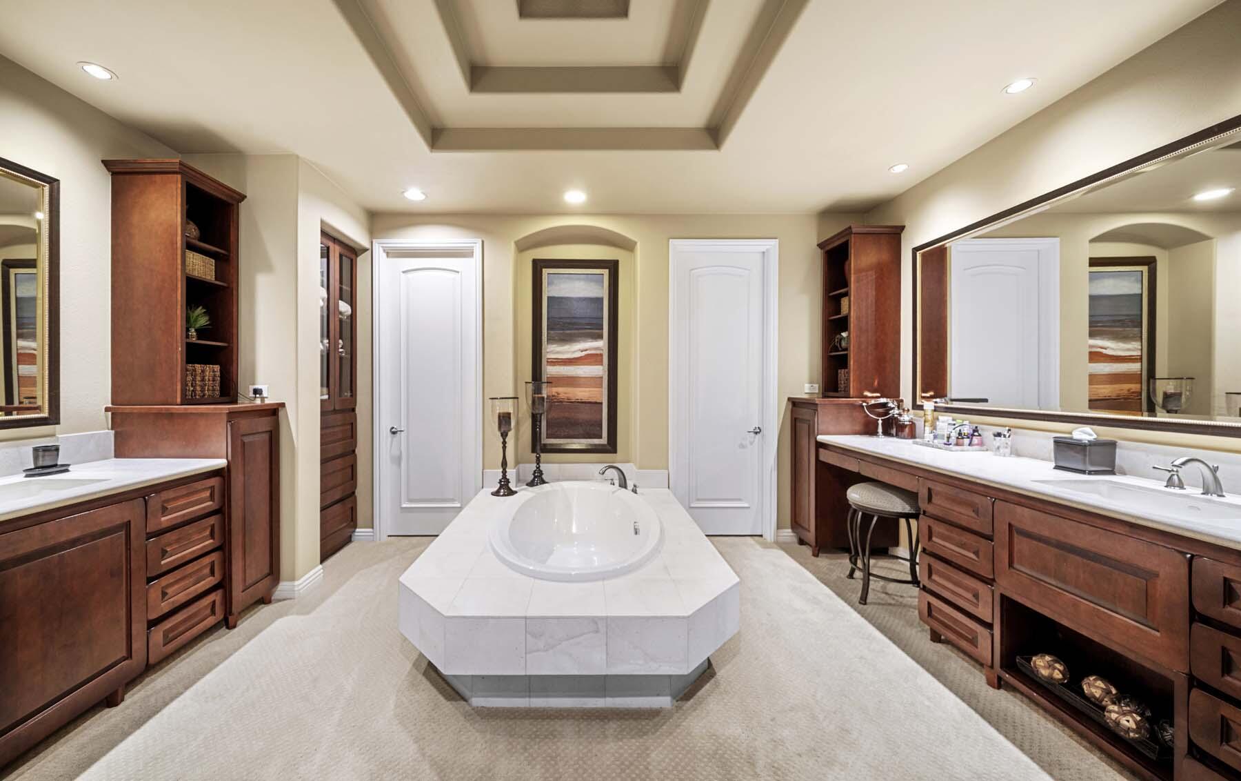 76128 Via Firenze Indian Wells, CA 92210 - Photo 48 of 67 a spacious bathroom with a double vanity sink a large mirror and a bathtub