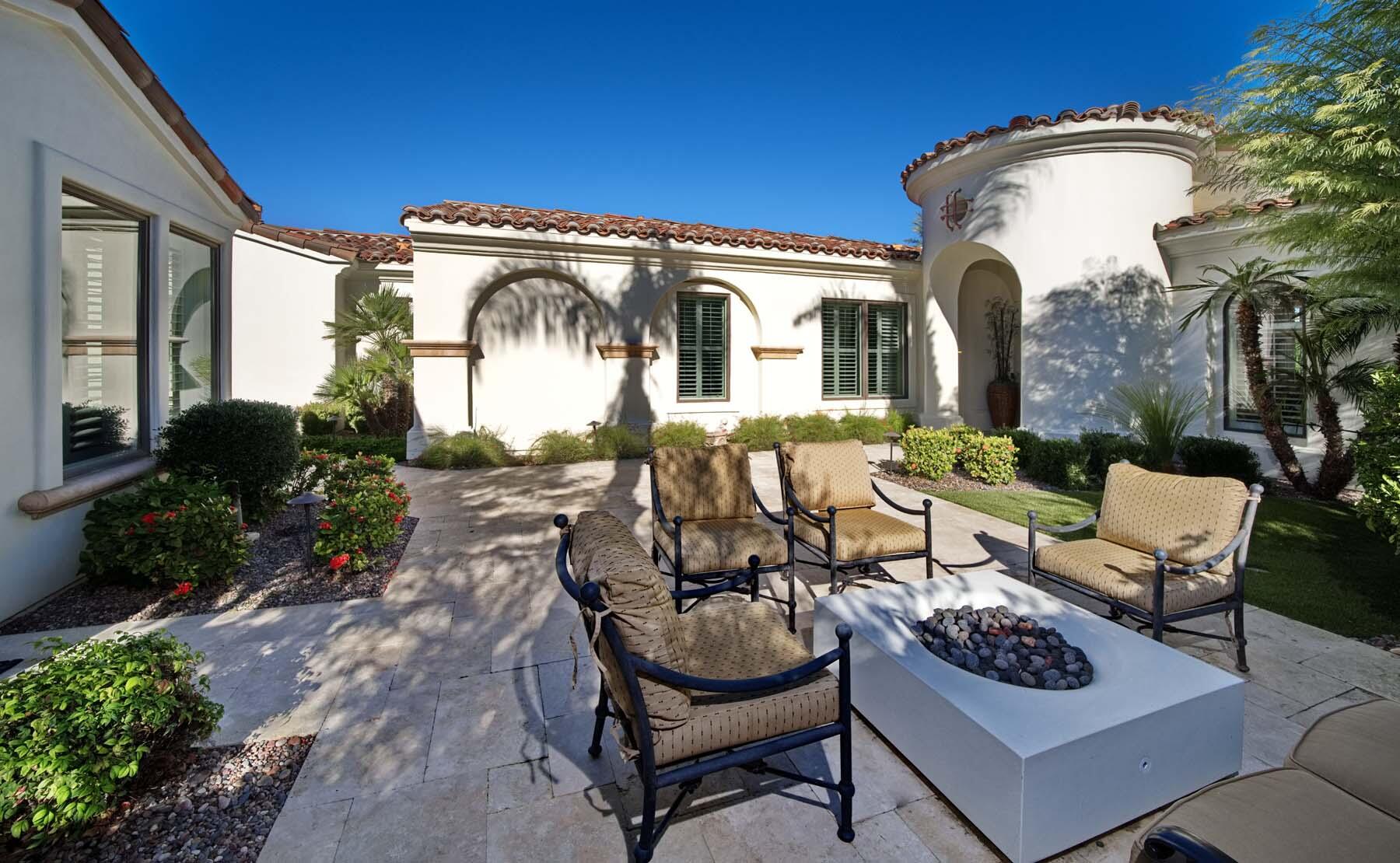 76128 Via Firenze Indian Wells, CA 92210 - Photo 5 of 67 a view of a patio with couches table and chairs and potted plants
