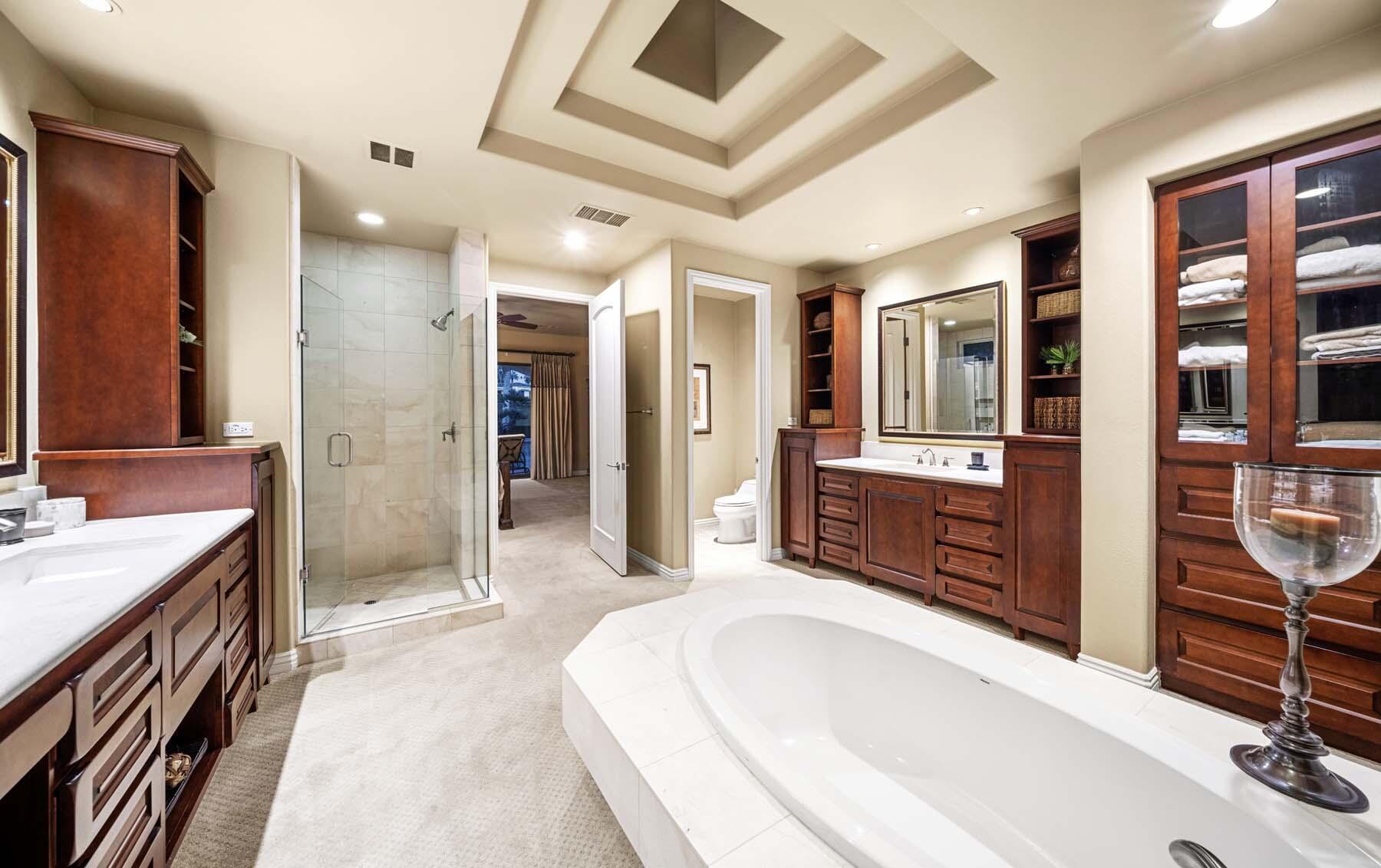 76128 Via Firenze Indian Wells, CA 92210 - Photo 51 of 67 a spacious bathroom with a tub sink shower and mirror