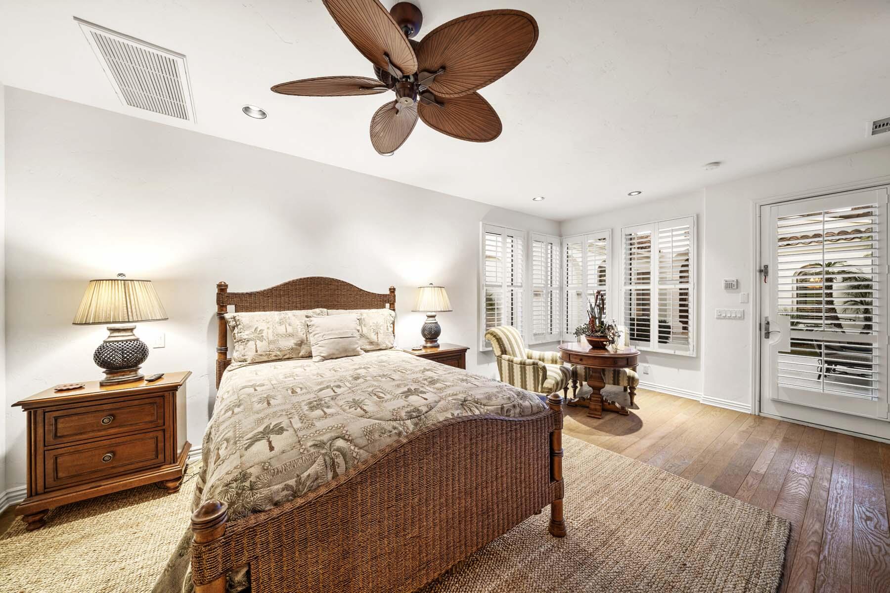 76128 Via Firenze Indian Wells, CA 92210 - Photo 52 of 67 a bedroom with a bed couch and window