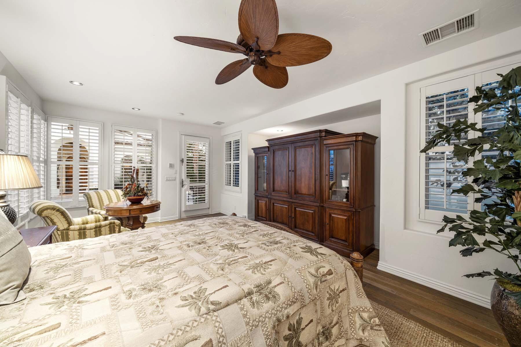 76128 Via Firenze Indian Wells, CA 92210 - Photo 53 of 67 a bed room with a bed and a large mirror