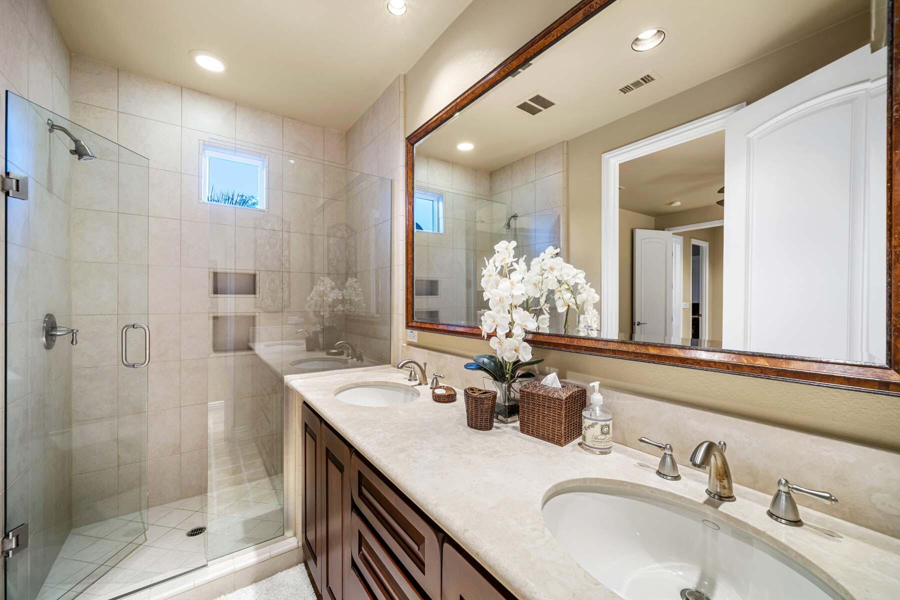76128 Via Firenze Indian Wells, CA 92210 - Photo 58 of 67 a bathroom with a granite countertop sink a mirror and shower