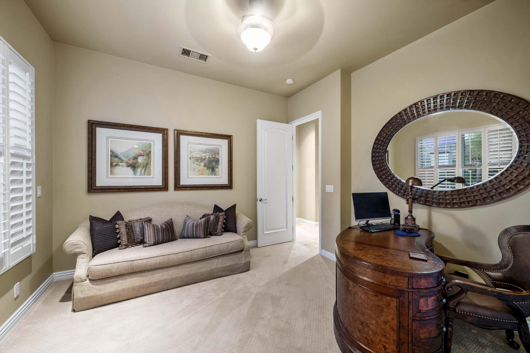 76128 Via Firenze Indian Wells, CA 92210 - Photo 61 of 67 a living room with furniture a mirror and a clock