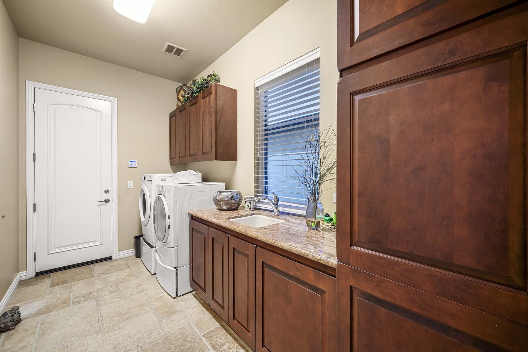 76128 Via Firenze Indian Wells, CA 92210 - Photo 65 of 67 a utility room with dryer and washer
