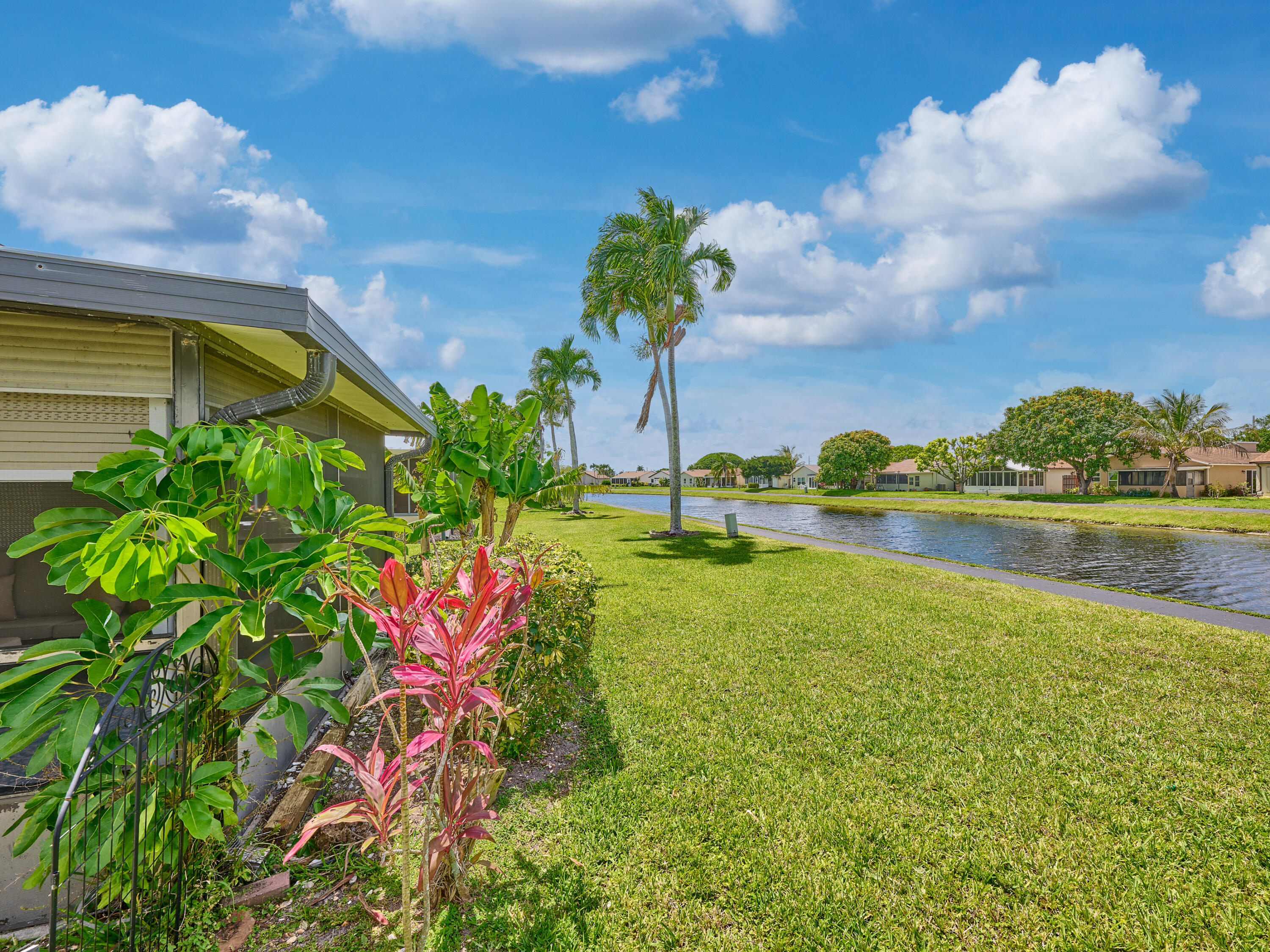 5197 Minto Road Boynton Beach, FL 33472 - Photo 22 of 32 a view of a lake with a building in the background