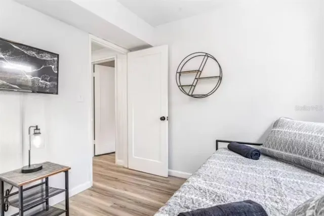 a bedroom with a bed and a chair