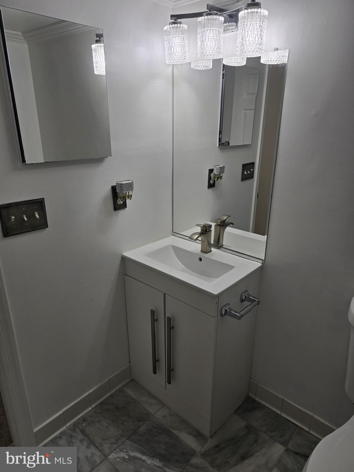 12708 Dunkirk Drive Upper Marlboro, MD 20772 - Photo 19 of 19 a bathroom with a sink and mirror