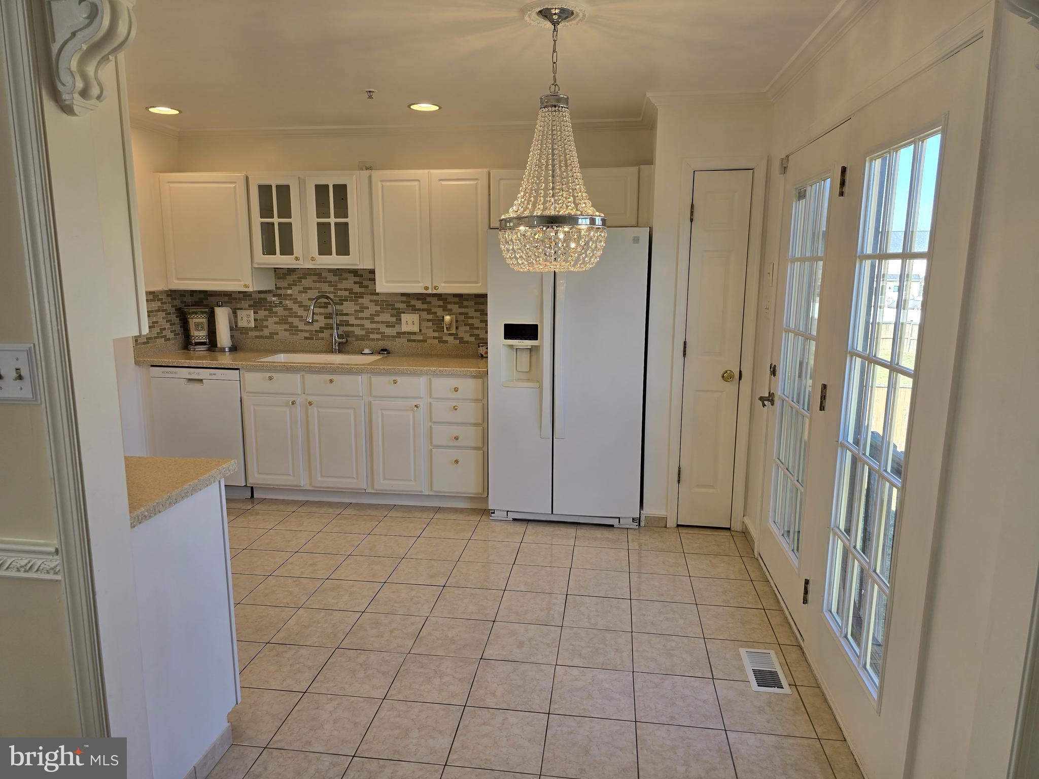 12708 Dunkirk Drive Upper Marlboro, MD 20772 - Photo 7 of 19 a bathroom with a granite countertop sink a mirror and a shower