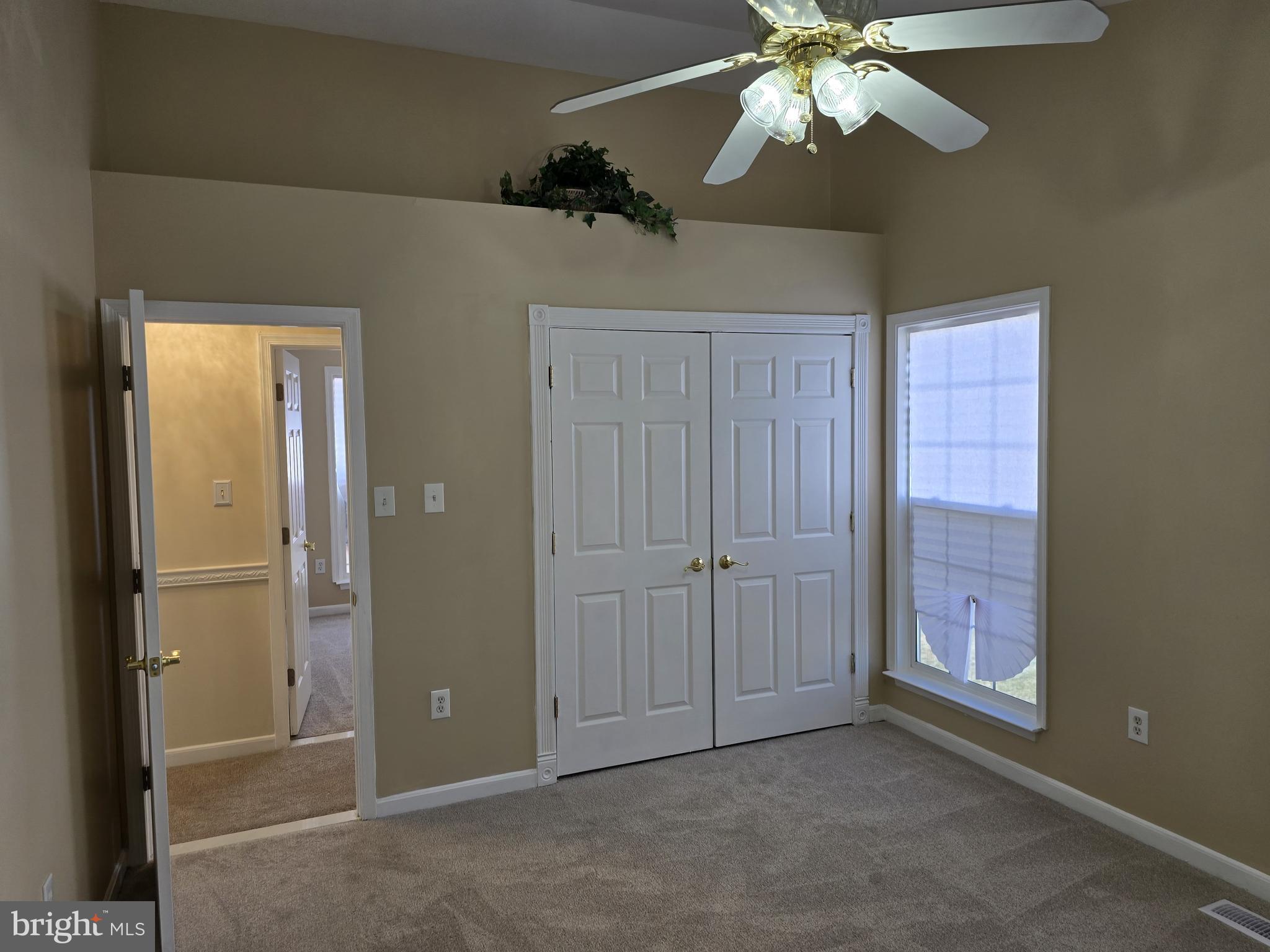 12708 Dunkirk Drive Upper Marlboro, MD 20772 - Photo 9 of 19 a view of a chandelier fan and a chandelier fan in a room