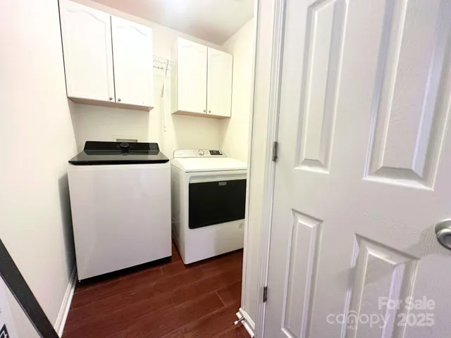 a kitchen with stainless steel appliances a white stove top oven and cabinets